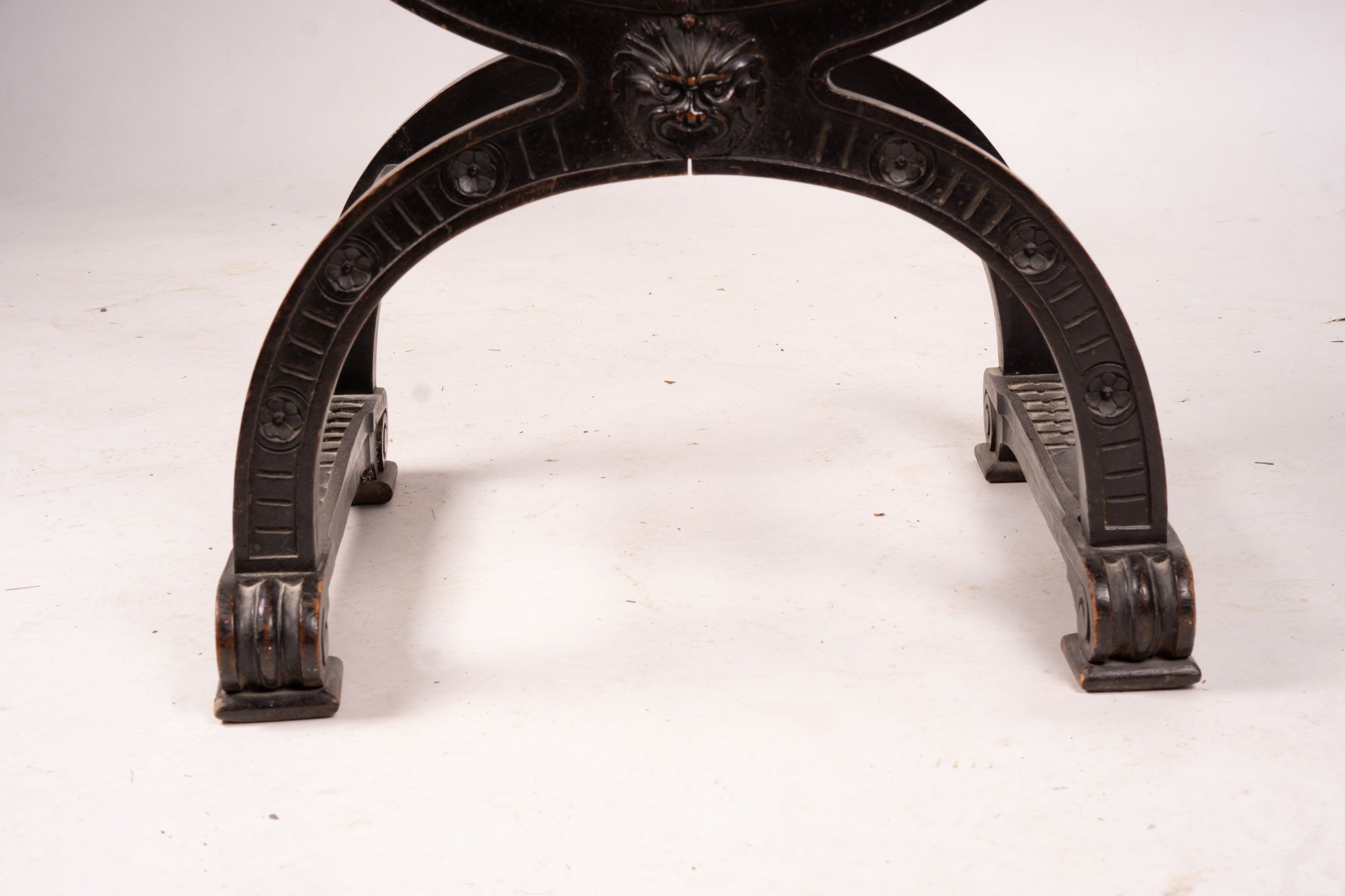 An ebonised Sagrada style elbow chair